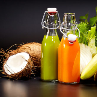 Glasses with fresh vegetable juices isolated on black. Detox